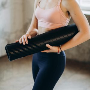 Woman Holding her Yoga Mat